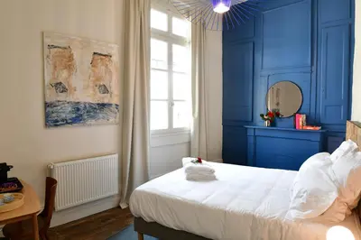 Un ou plusieurs lits dans un hébergement de l'établissement Les Chambres du Cloître
