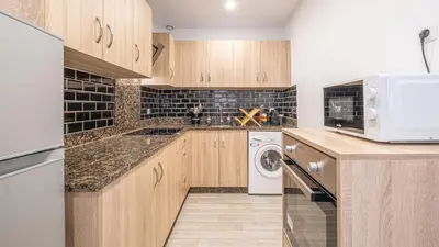 Cuisine ou kitchenette dans l'établissement Le Vertuose - Welc'Home