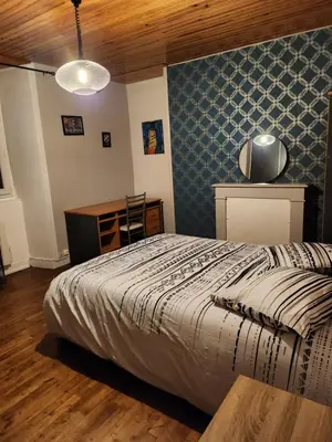 Un ou plusieurs lits dans un hébergement de l'établissement La chambre d'Antoine