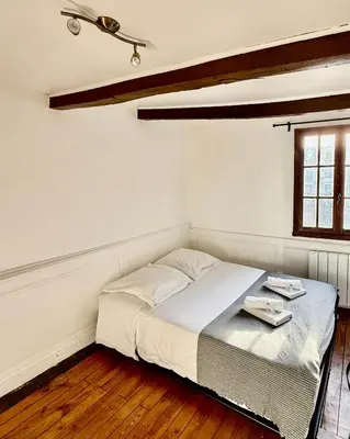 Un ou plusieurs lits dans un hébergement de l'établissement «Studio 1 » Rue Huchette -DABNB