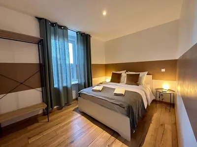 Un ou plusieurs lits dans un hébergement de l'établissement LesCinqSuites/12 couchages-DABNB