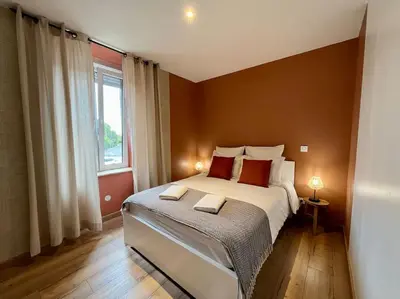 Un ou plusieurs lits dans un hébergement de l'établissement LesCinqSuites/12 couchages-DABNB