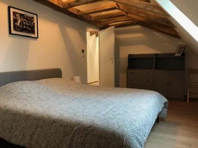 Un ou plusieurs lits dans un hébergement de l'établissement Gite du Haras de la Cour
