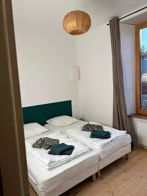 Un ou plusieurs lits dans un hébergement de l'établissement Appartement de la côte