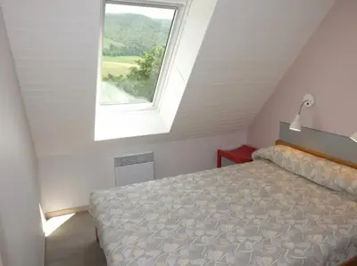 Un ou plusieurs lits dans un hébergement de l'établissement Gîte 18 Confortable au Pied du Puy Mary 4-6 Pers