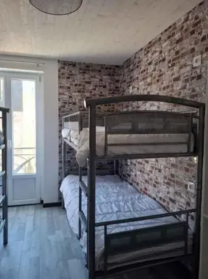 Un ou plusieurs lits dans un hébergement de l'établissement le nid des choups esprit cocoon 2 chambres