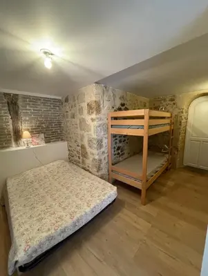 Un ou plusieurs lits dans un hébergement de l'établissement Appartement centre ville 4 personnes