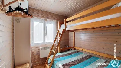 Un ou plusieurs lits dans un hébergement de l'établissement Chalet de la Gougère 2